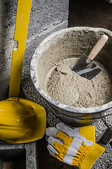 Image showing Tools for bricklayer bucket with a solution and a trowel, close-