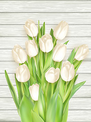 Image showing White tulips on light wooden background. EPS 10