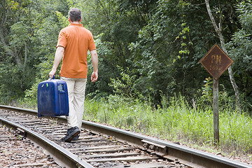 Image showing Man with suitcase on railway