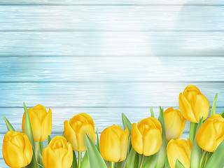 Image showing Yellow tulips flowers on wooden planks. EPS 10