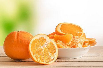 Image showing Oranges on a wooden table