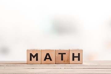 Image showing Math lesson sign on a wooden table