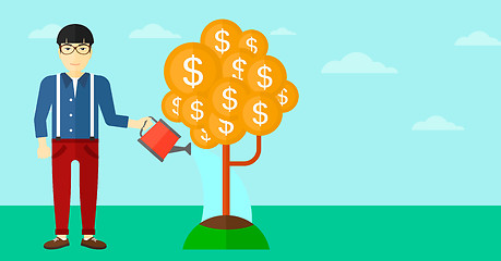 Image showing Man watering money tree.