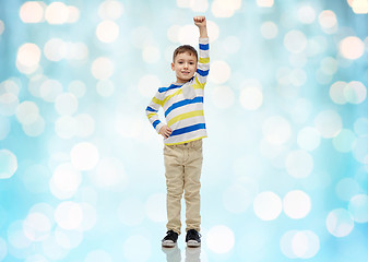 Image showing happy smiling little boy with raised hand