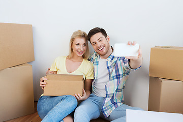 Image showing couple with taking smartphone selfie and moving