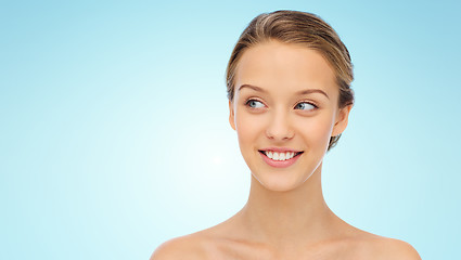 Image showing smiling young woman face and shoulders