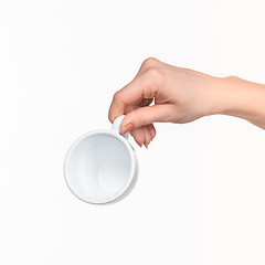 Image showing Woman hand with cup on white background