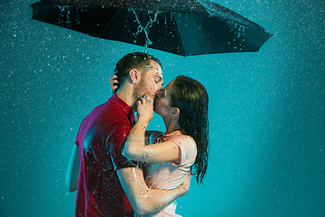 Image showing The loving couple in the rain