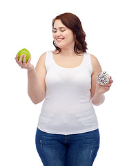 Image showing happy plus size woman choosing apple or cookie