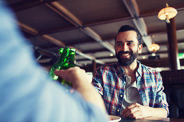 Image showing happy male friends drinking beer at bar or pub