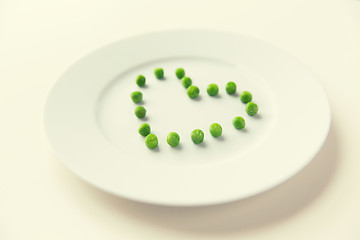 Image showing close up of plate with peas in heart shape 