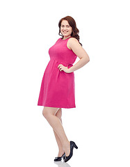 Image showing happy young plus size woman posing in pink dress