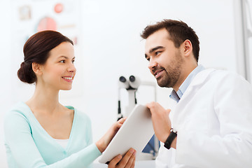 Image showing optician with tablet pc and patient at eye clinic