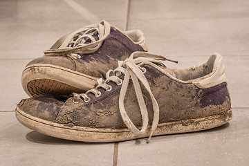 Image showing Dirty shoes with mud and soil