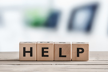 Image showing Help sign on a wooden table