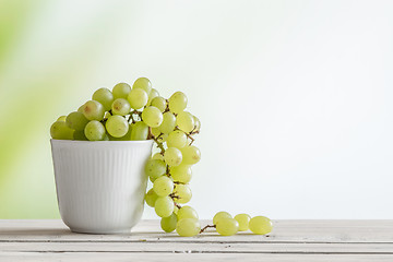 Image showing Cup with green grapes