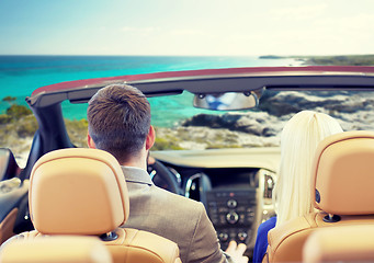 Image showing couple driving in cabriolet car over sea shore