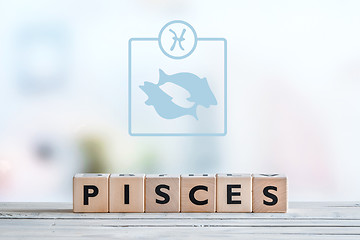 Image showing Pisces star sign on a table