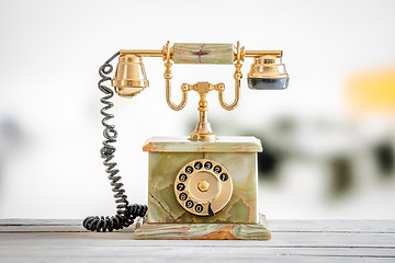 Image showing Antique telephone in gold and marble