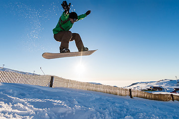 Image showing Snowboarder at jump