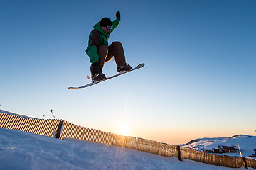Image showing Snowboarder at jump