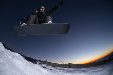 Image showing Snowboarding in the mountains