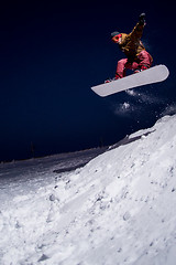 Image showing Snowboarder jumping