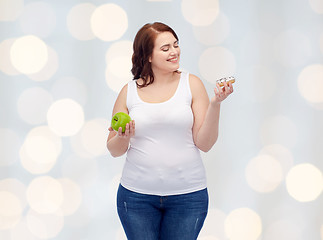 Image showing happy plus size woman choosing apple or donut