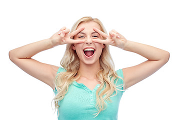 Image showing smiling young woman or teenage girl showing peace