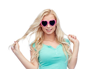 Image showing happy young woman in heart shape sunglasses