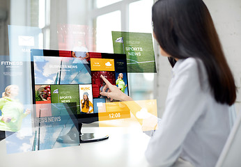 Image showing close up of woman with news on computer in office