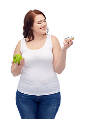 Image showing happy plus size woman choosing apple or cookie