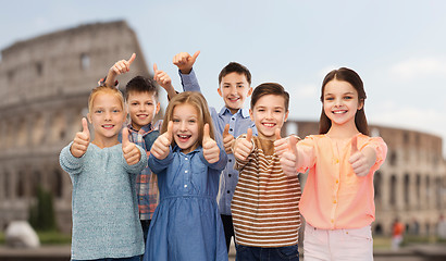 Image showing children showing thumbs up over coliseum in rome