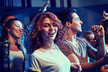 Image showing happy friends dancing at night club