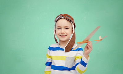 Image showing happy little boy in aviator hat with airplane