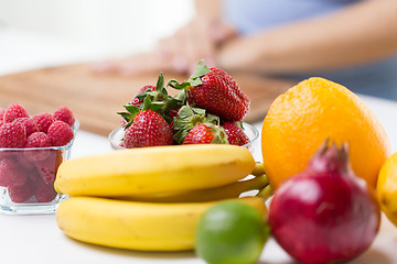 Image showing close up of fresh fruits and berries on table