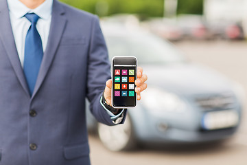 Image showing close up of business man with smartphone menu