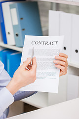 Image showing close up of businessman holding contract document