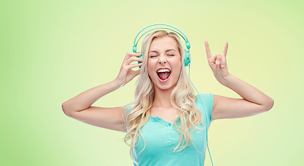 Image showing happy young woman or teenage girl with headphones