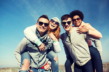 Image showing happy friends in shades having fun outdoors