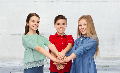 Image showing happy children with hands on top