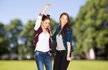 Image showing happy smiling pretty teenage girls dancing