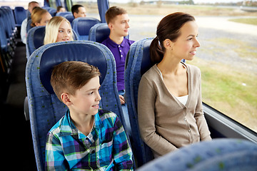 Image showing happy family riding in travel bus