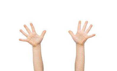 Image showing close up of little child hands raised upwards