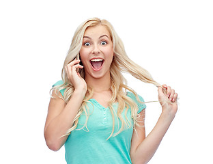 Image showing smiling young woman calling on smartphone