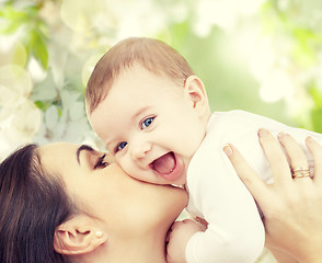 Image showing happy laughing baby playing with mother