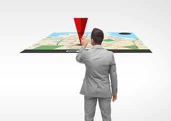 Image showing businessman with projection of navigator map