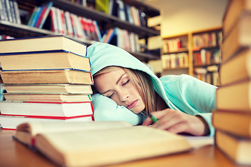 Image showing student or woman with books sleeping in library