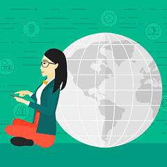 Image showing Woman sitting near globe.