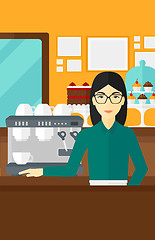 Image showing Barista standing near coffee maker.